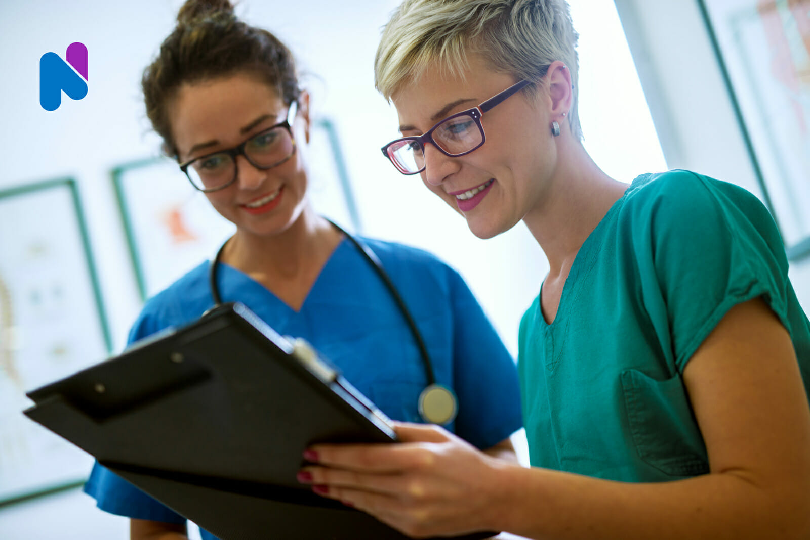 nurses-smiling-over-clipboard