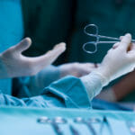 nurses in surgery center operating on a patient