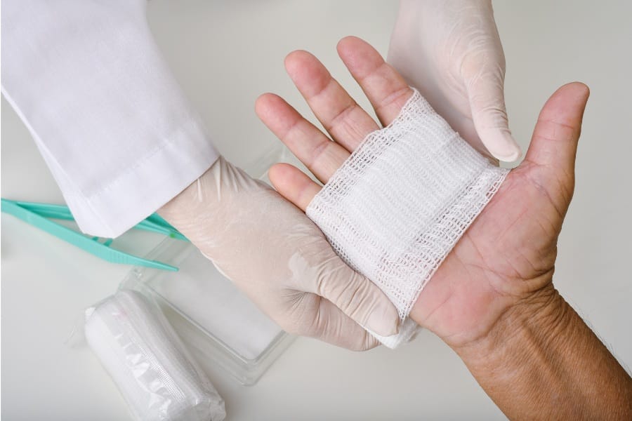 A person with a hand injury post-surgery