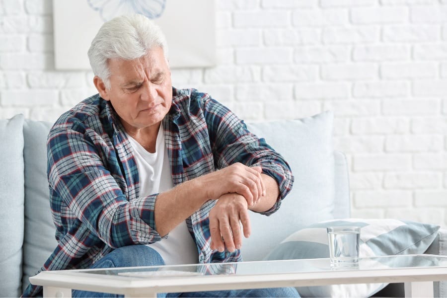 A man experiencing symptoms of Parkinson's Disease
