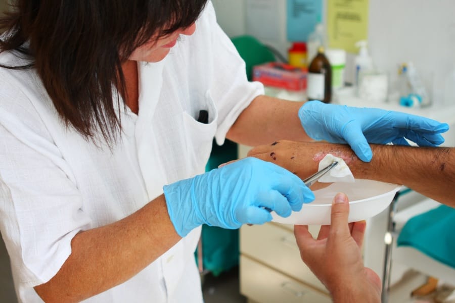 patient receiving post-op wound care