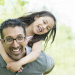 father-with-daughter-outside-in-sunlight