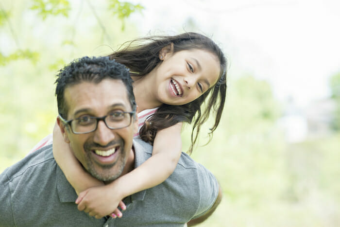 father-with-daughter-outside-in-sunlight