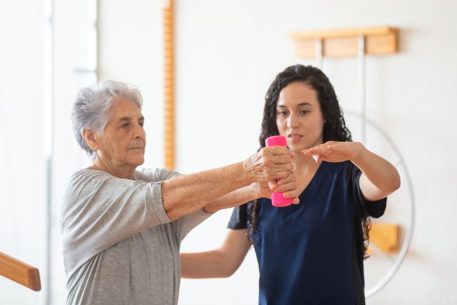 physical therapist assisting a patient