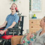 man in wheelchair sitting with woman