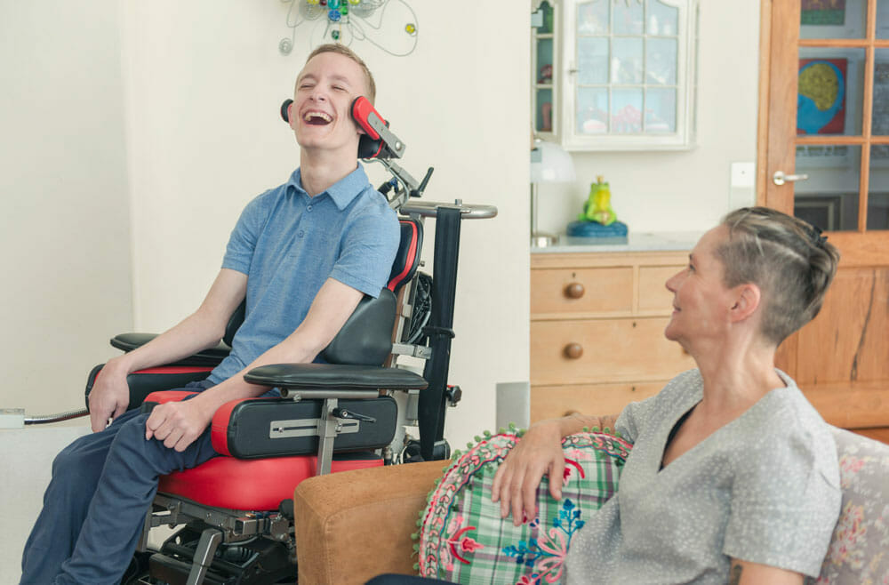 man in wheelchair sitting with woman