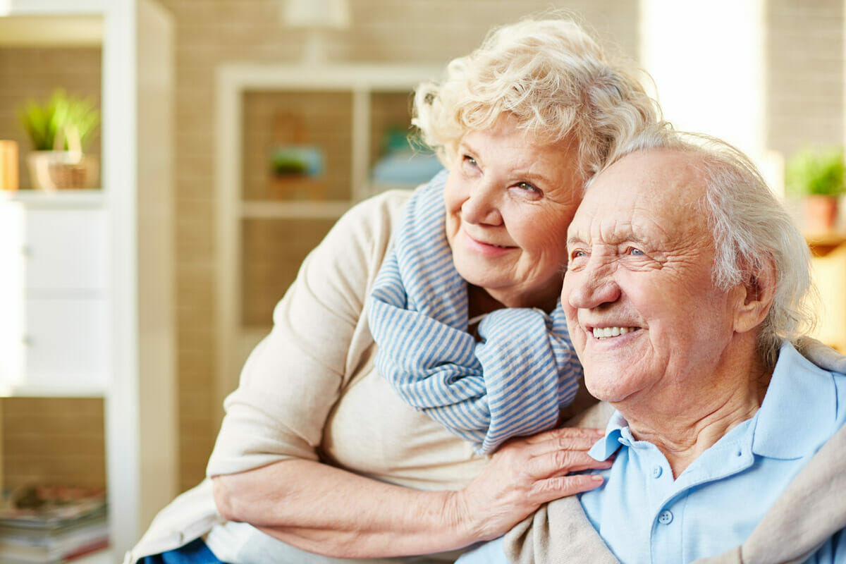 senior couple hugging and smiling