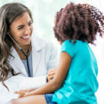 happy-nurse-with-pediatric-patient