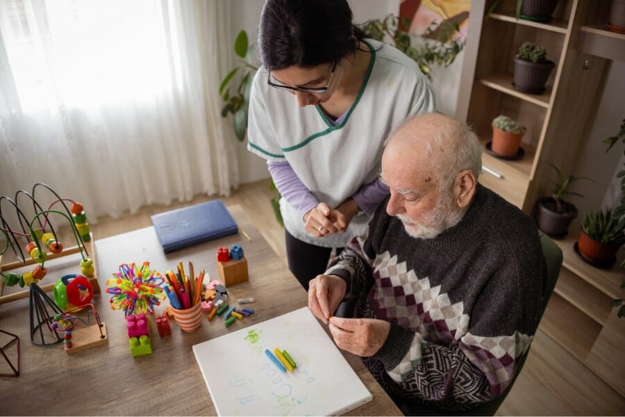 a caregiver working with an AD patient