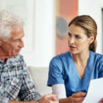 private duty nurse talking with fiduciary client about care