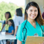 nurse smiling happily at work