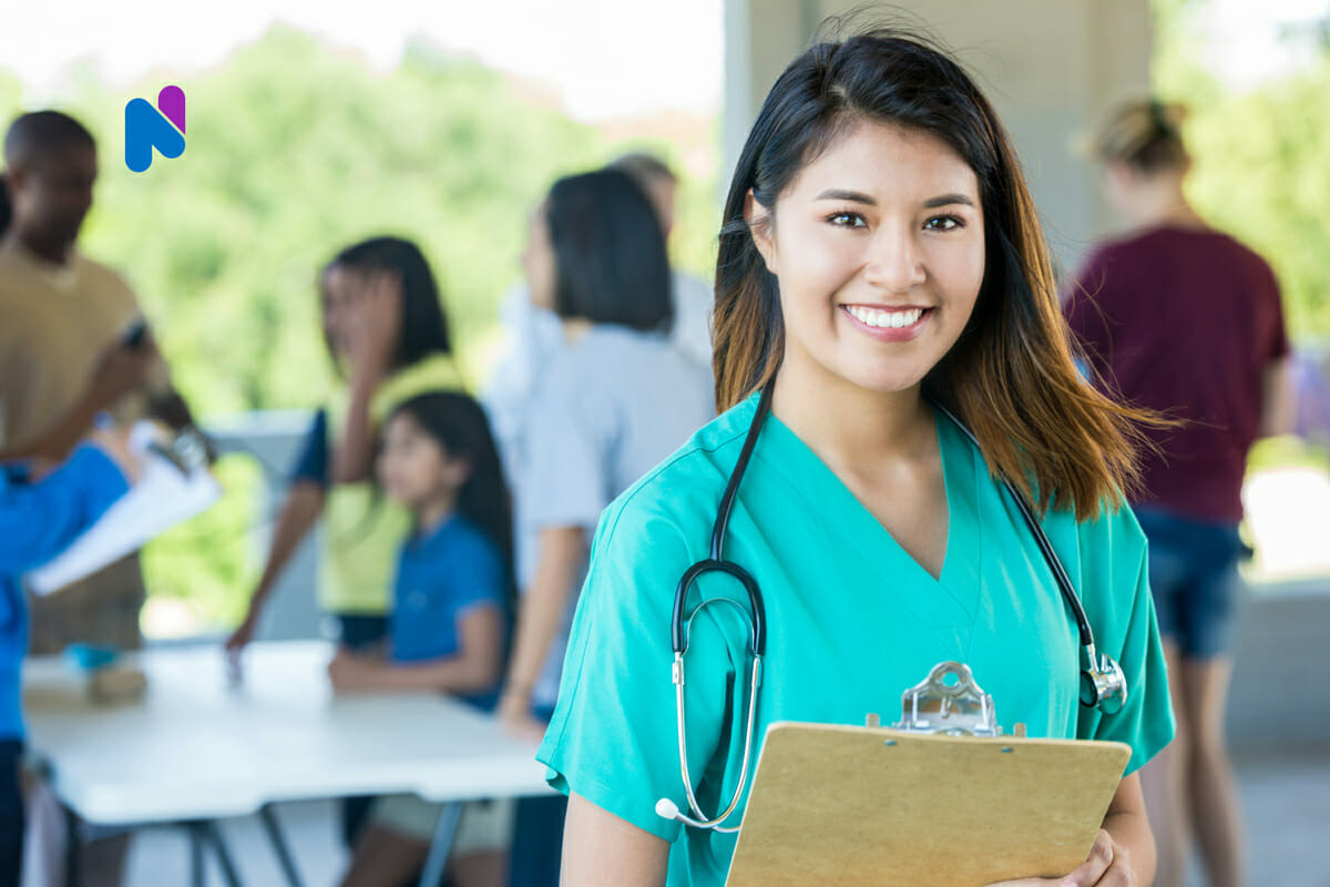 nurse smiling happily at work