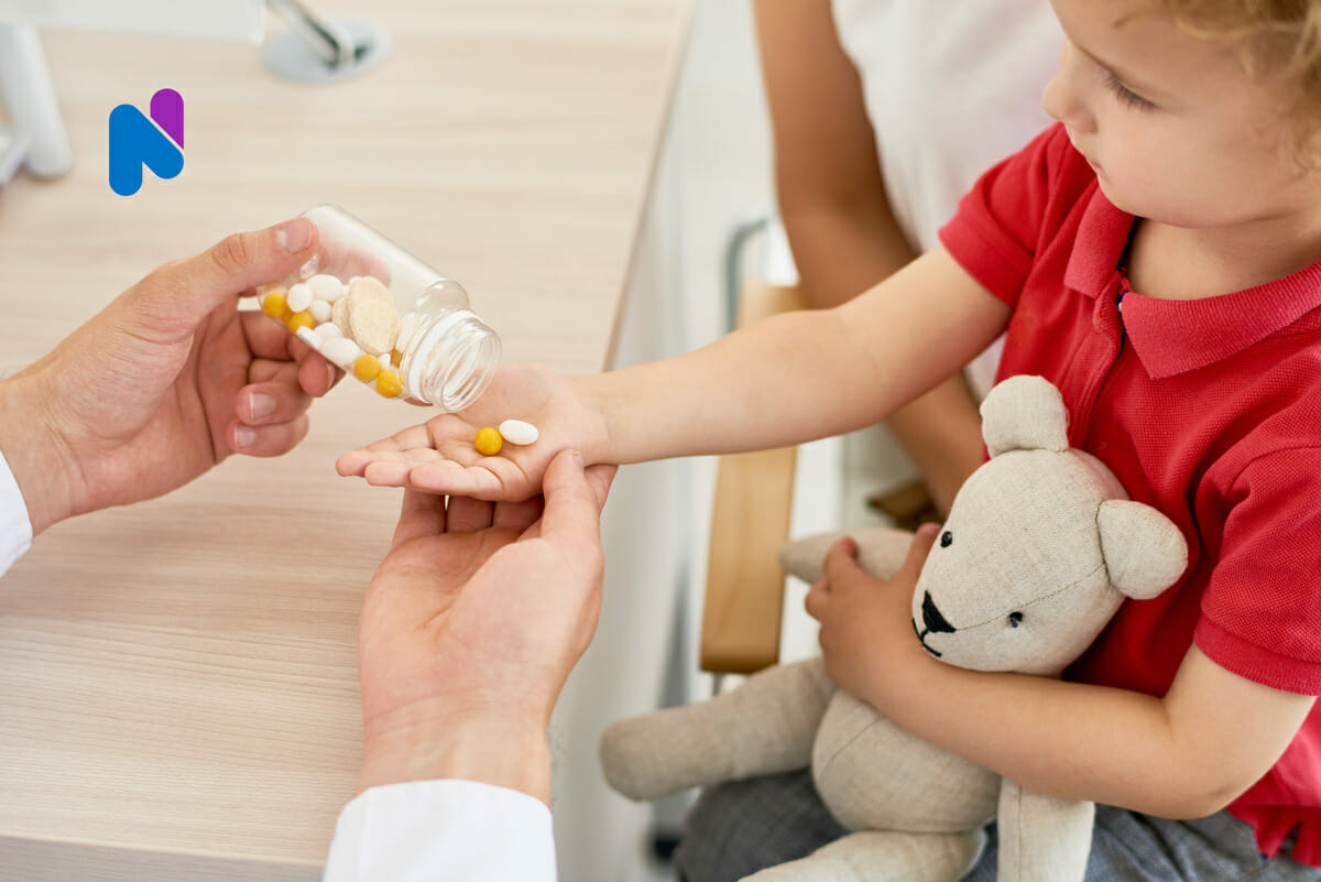 adult handing kid medication