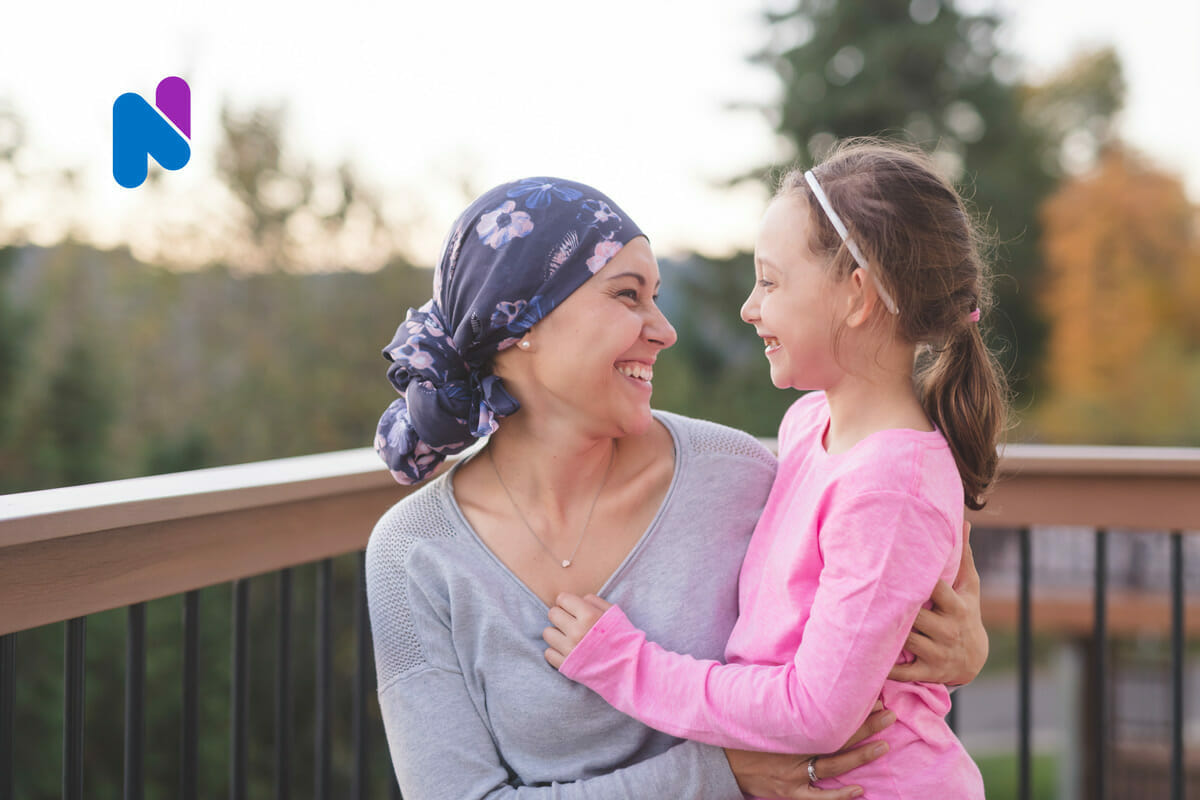 mom and daughter smiling