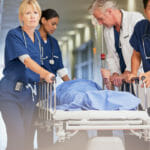 Nurse staff with patient on gurney
