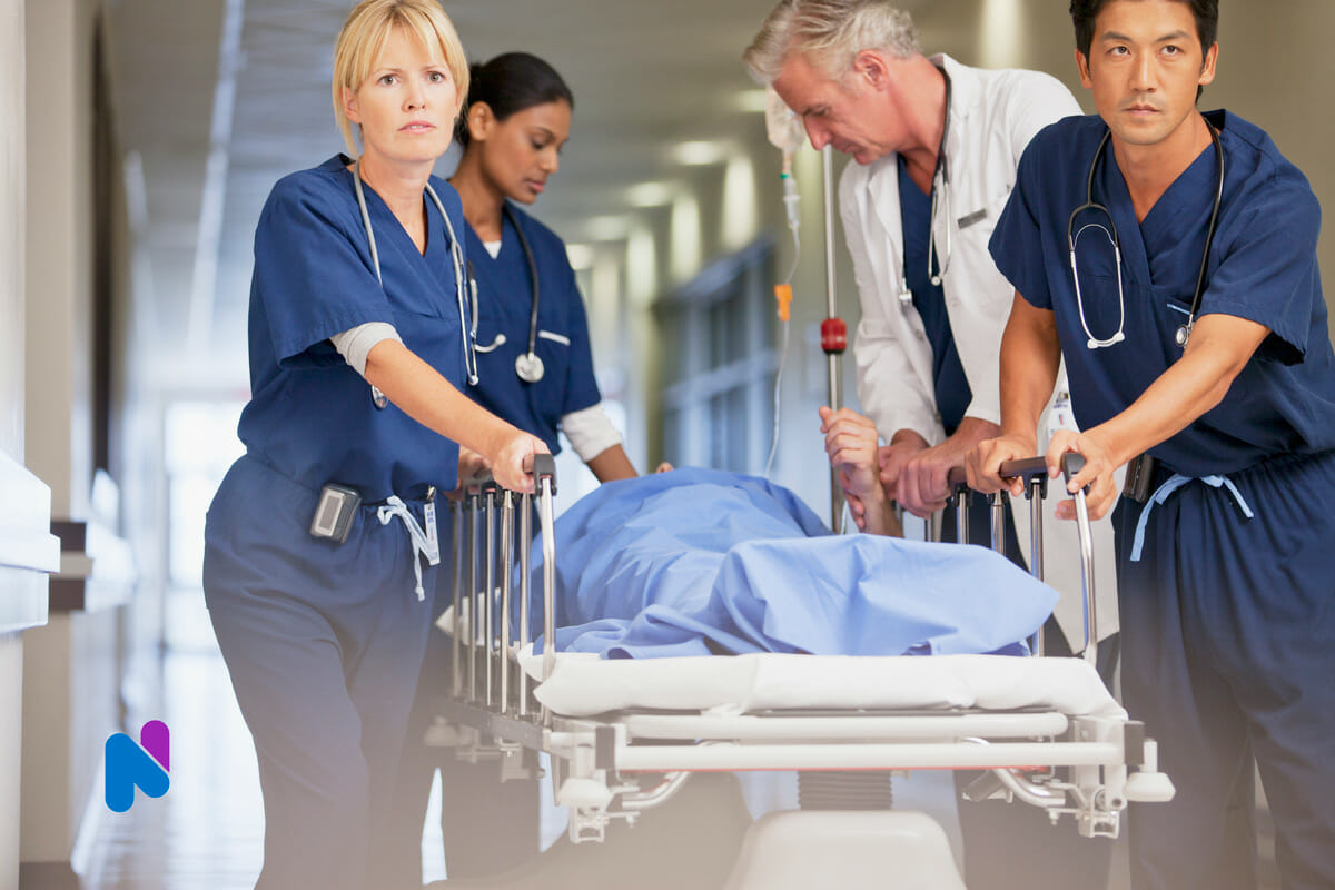 Nurse staff with patient on gurney