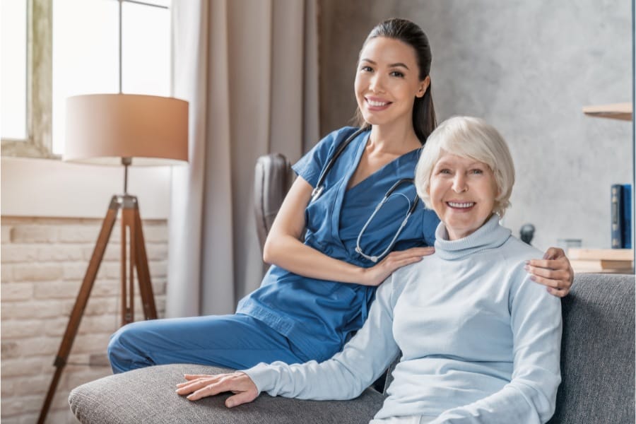 nurse and senior patient smiling