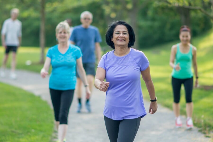 senior citizens with arthritis walking