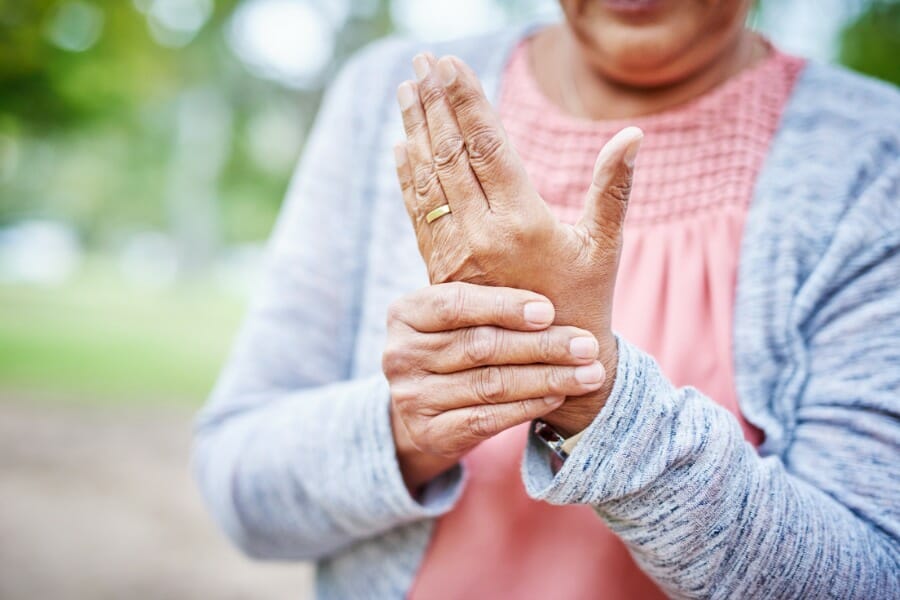 A woman suffering from arthritis pain.