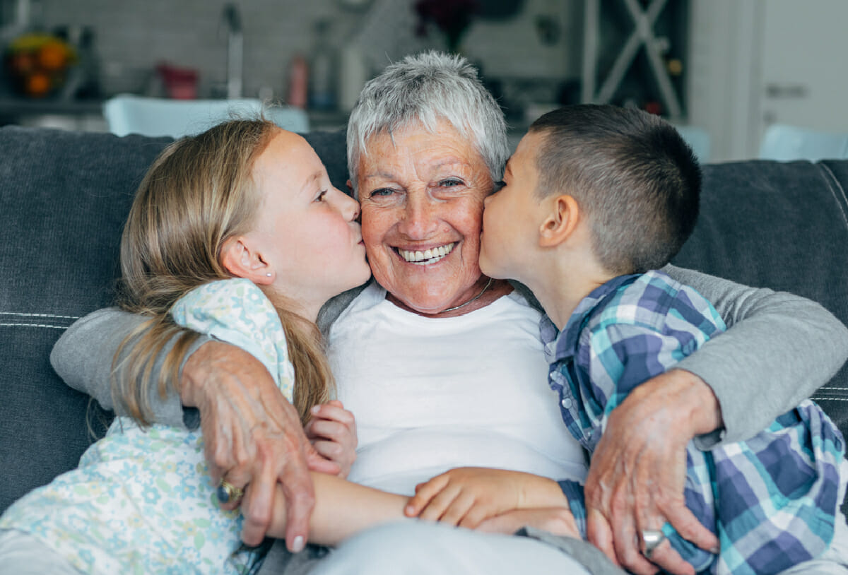 grandmother at home with grandchildren