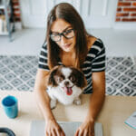 nurse filing taxes with her pup