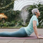 Older woman doing stretches outdoors