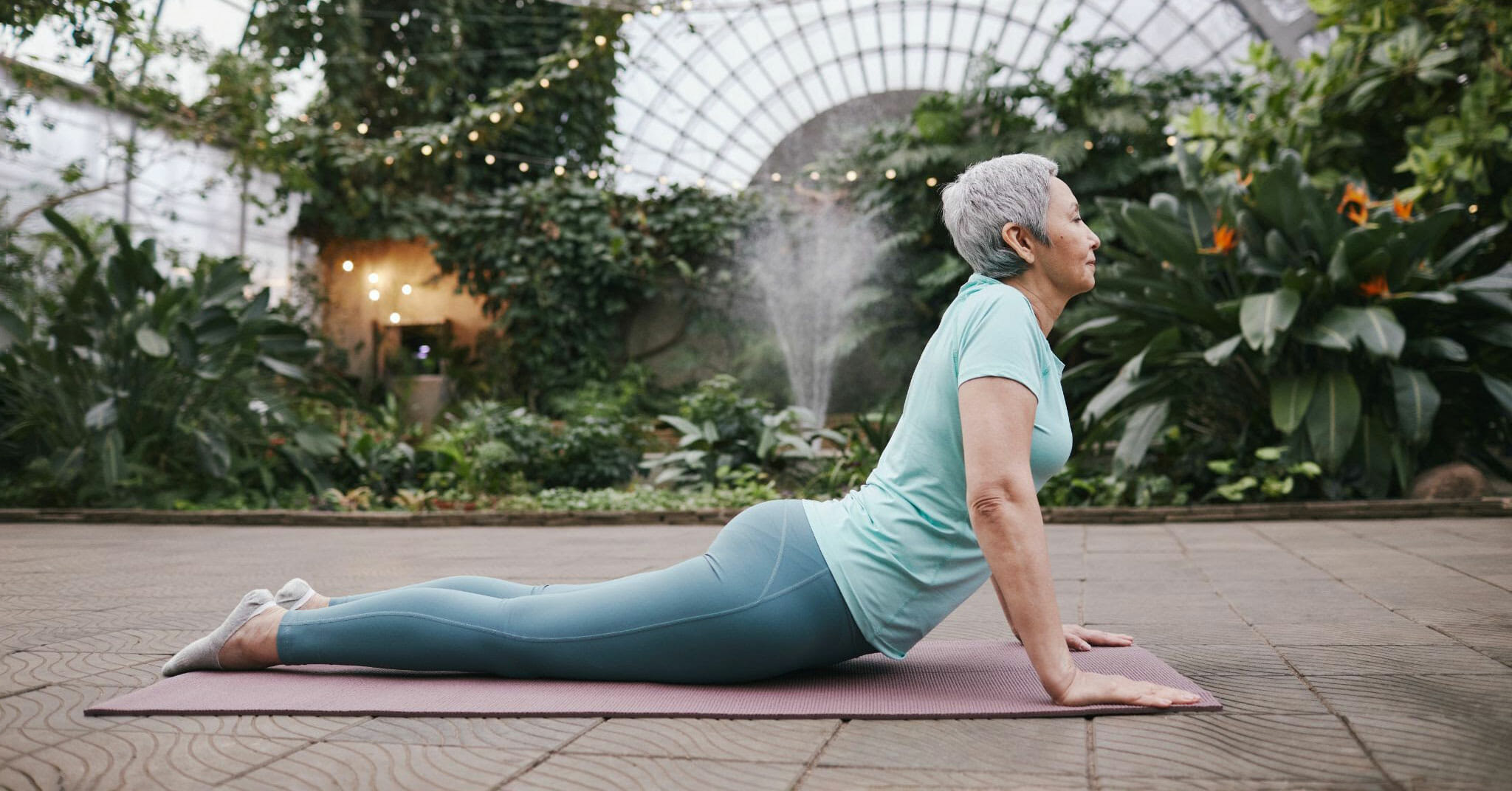 Older woman doing stretches outdoors