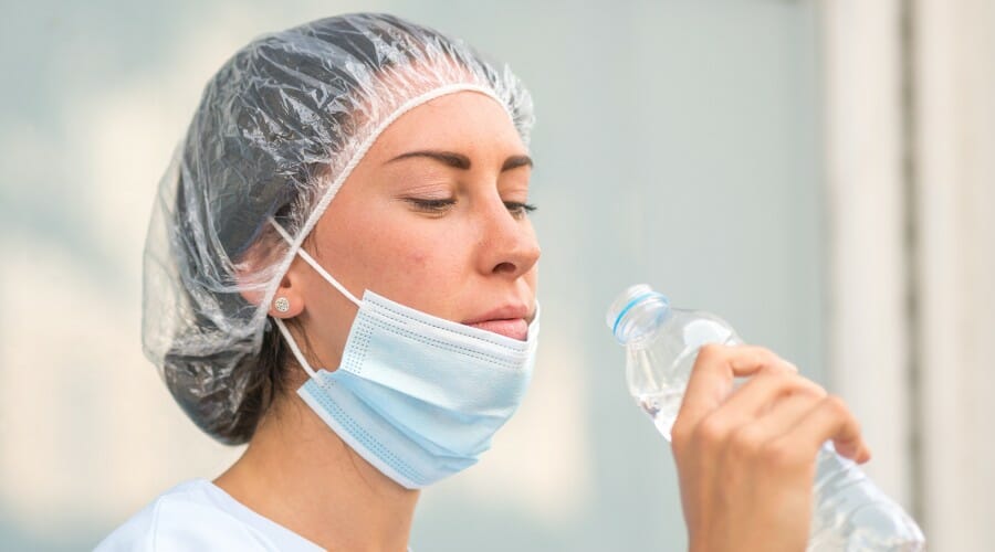 A night shift nurse drinking water.