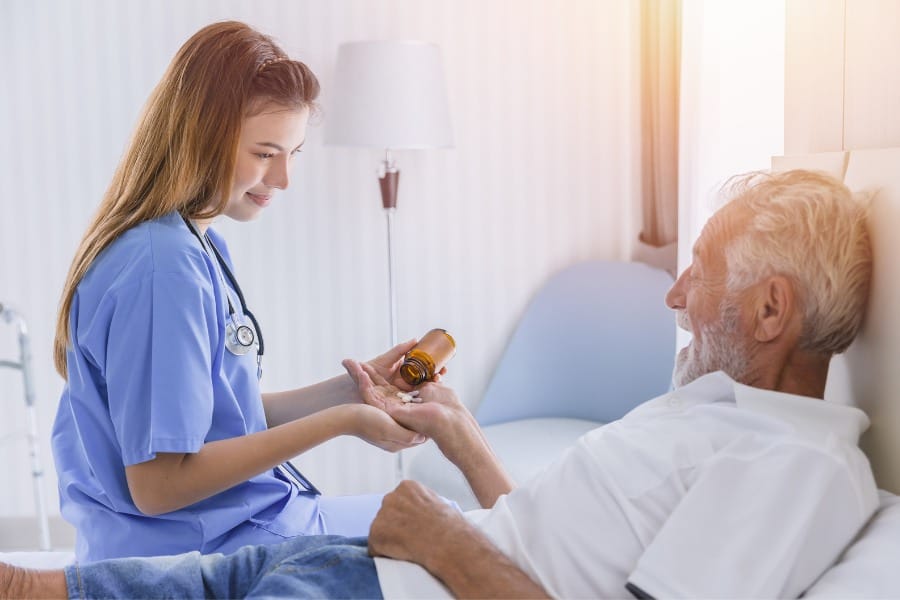 private duty nurse assisting elderly patient