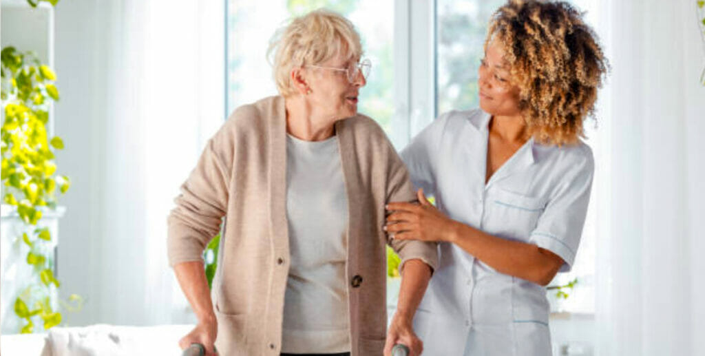 home-nurse-helping-patient-with-walker