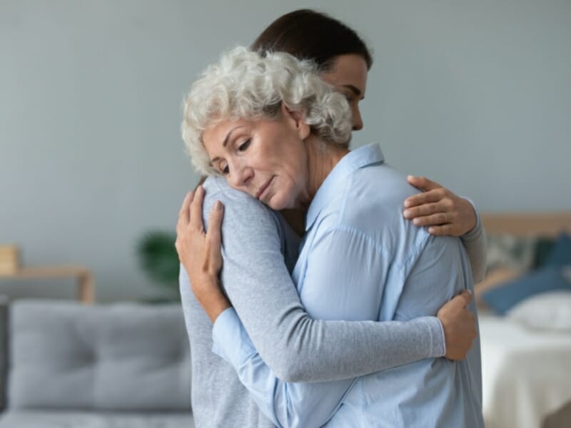 a woman receiving support after grieving
