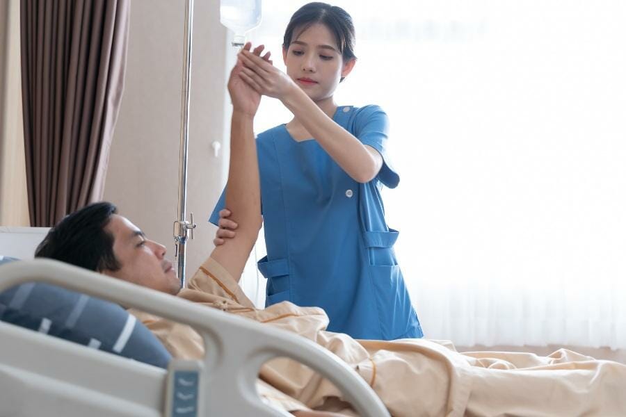 A nurse setting up IV Therapy in a skilled nursing facility.