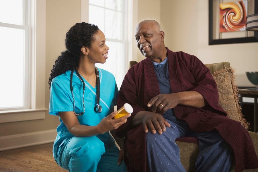 A private duty nurse assisting with medication management.