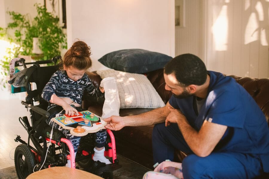 A male nurse providing exceptional pediatric care at home.