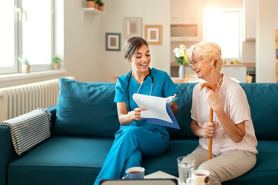 Private nurse showing her patient a new treatment plan.