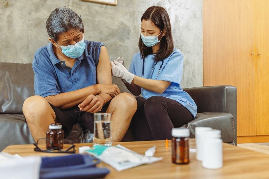 nurse administering an injection at a psychiatric facility.