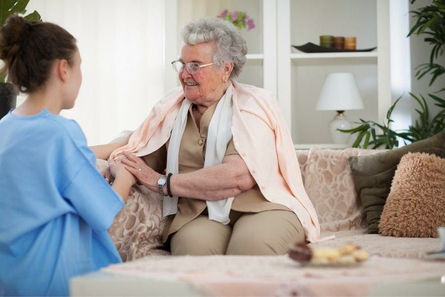 A private duty nurse with her elderly patient.
