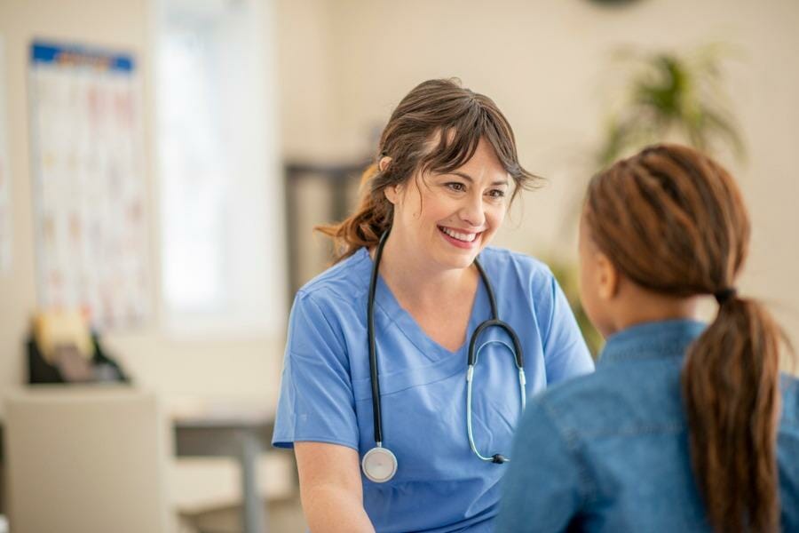 Per diem nurse working with a child.