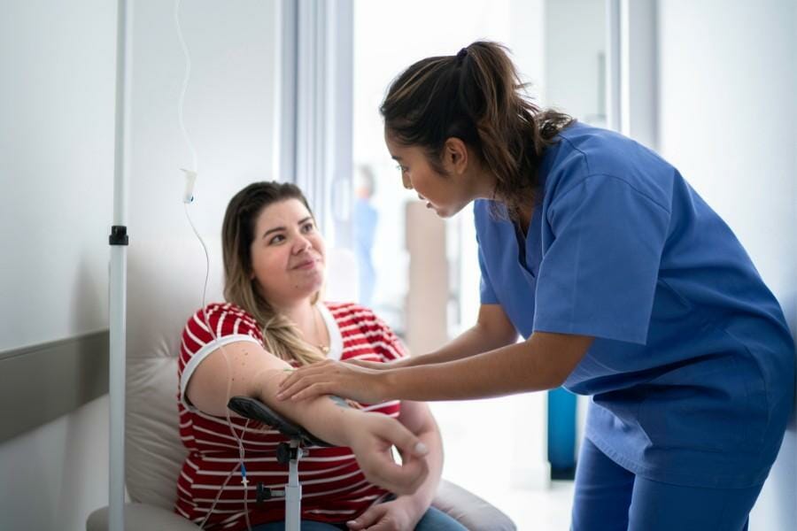 A nurse testing blood pressure at a doctor's office.