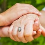 a loved one caring for a parkinson's patient
