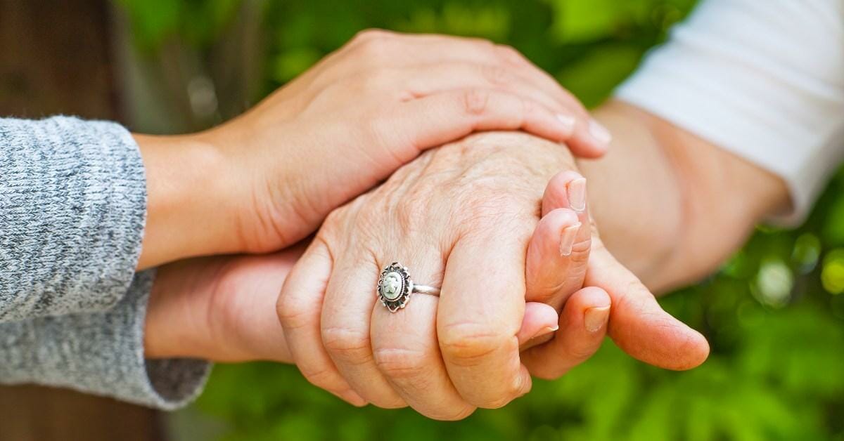 a loved one caring for a parkinson's patient