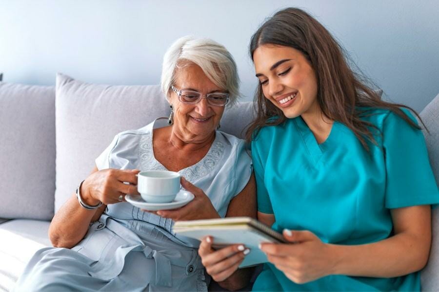 A private nurse going over a patient's assessment information.