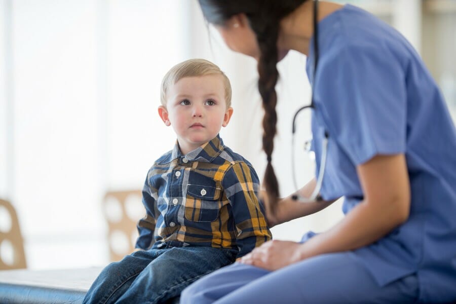 a pediatric nurse and a child patient.