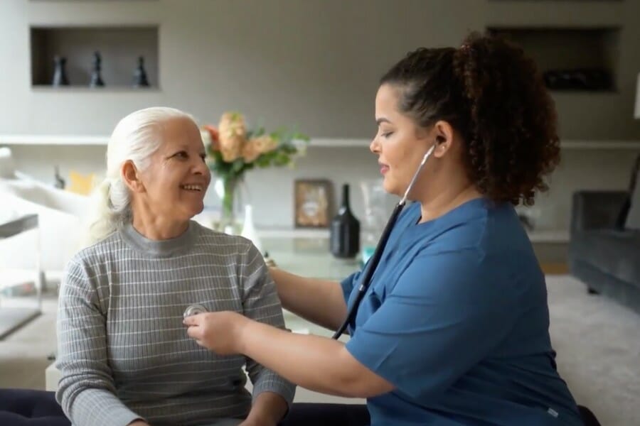 An in home nurse checking heart