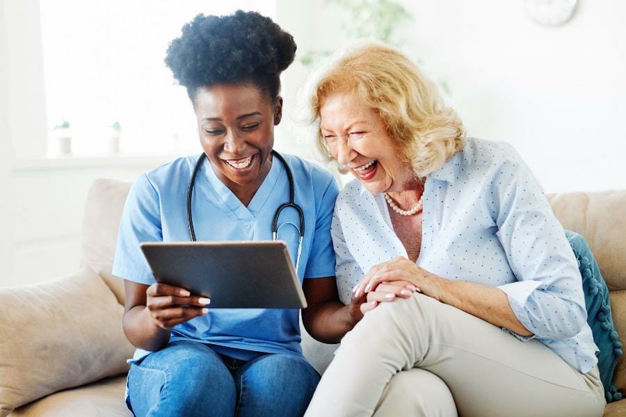 private nurse laughing with her client in Lake Sherwood