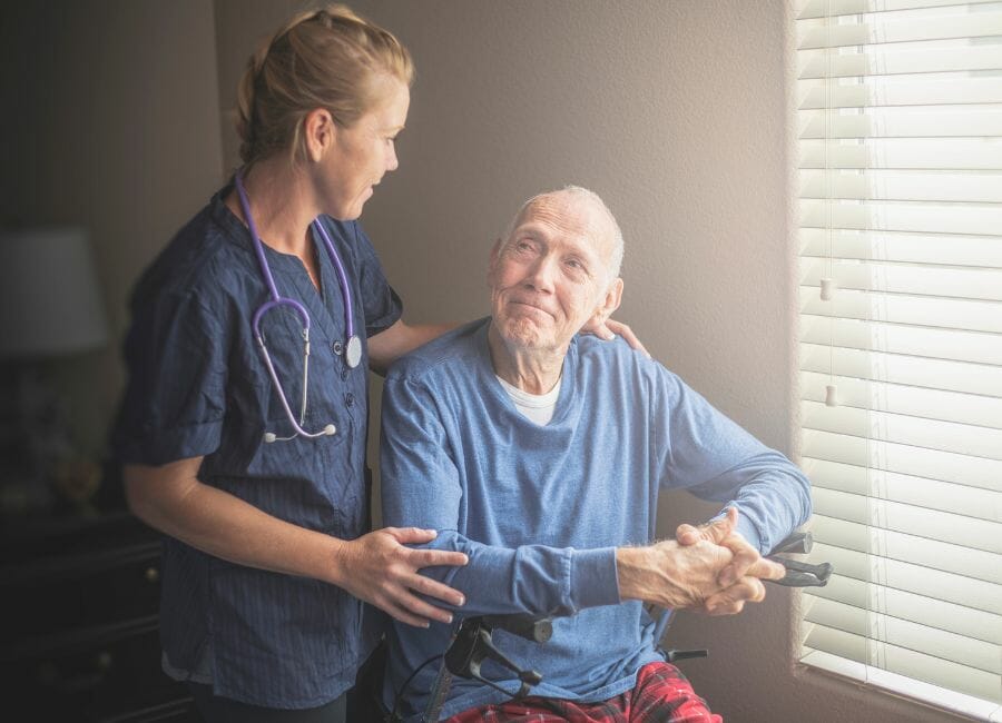 in home nurse in home nurse caring for a male patient.
