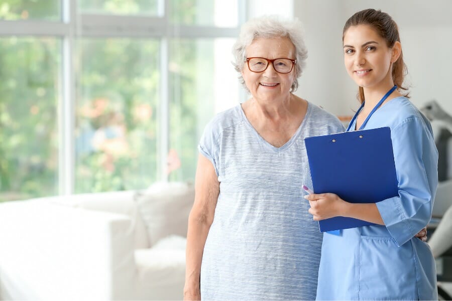 Private duty nurse smiling with her patient.