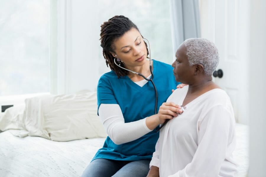 Rolling Hills private nurse checking her client's heartbeat.