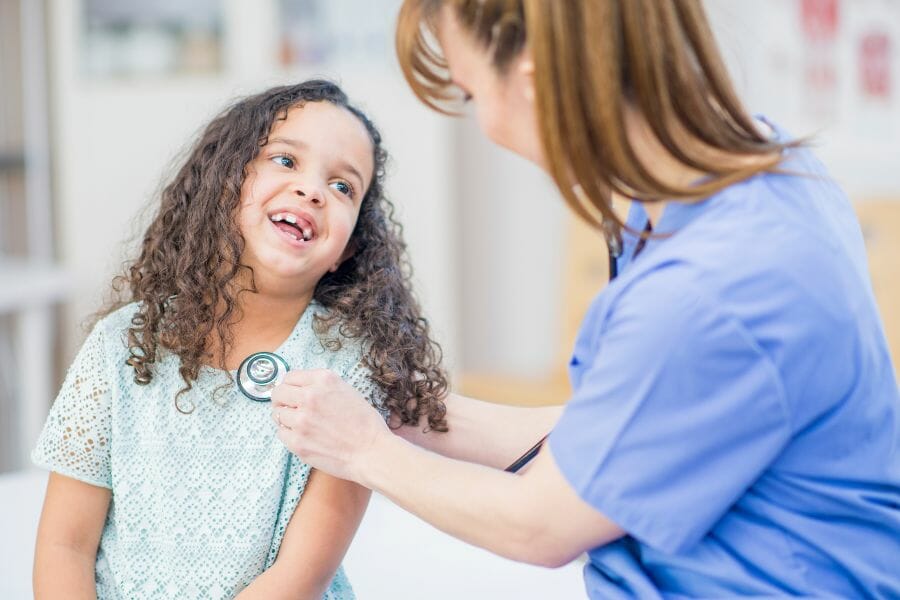 pediatric nurse and a young patient.