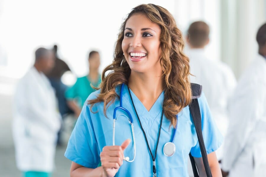 nurse smiling in a healthcare facility